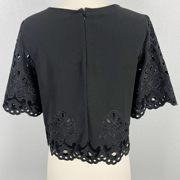 Bebe Laser Cut Floral Cropped Blouse with Scalloped Hem in Black medium top - Picture 3 of 4
